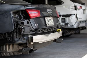 Rear and side of Audi needing auto body repair